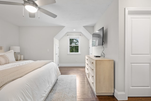 bedroom with ceiling fan and dark hardwood / wood-style floors