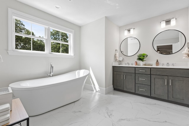 bathroom featuring vanity and a tub to relax in