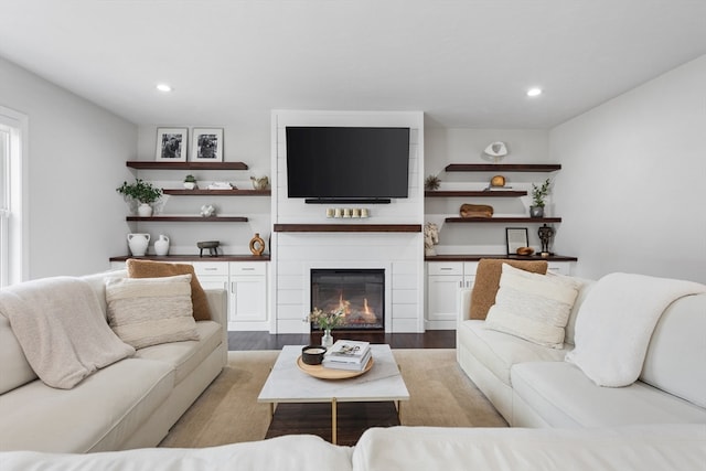 living room featuring light hardwood / wood-style floors and a fireplace