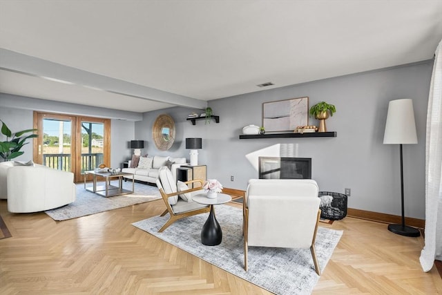 63 Seaside Rd, Scituate, MA 02066 - living area featuring baseboards and a glass covered fireplace