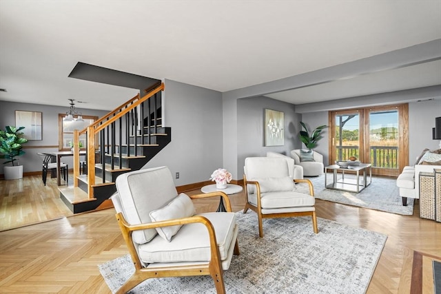63 Seaside Rd, Scituate, MA 02066 - living room featuring stairs and baseboards