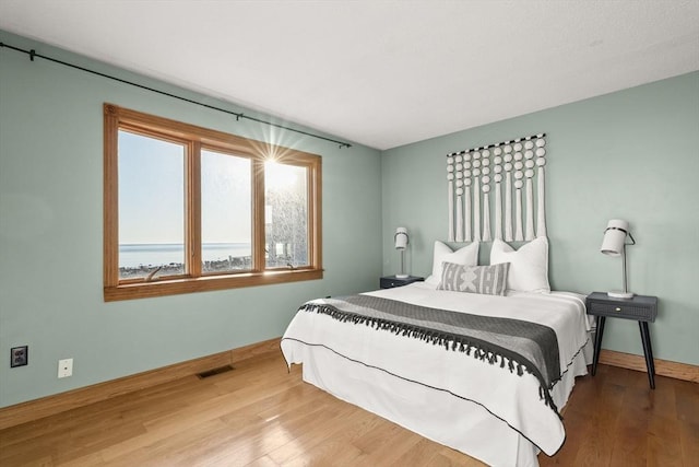 63 Seaside Rd, Scituate, MA 02066 - bedroom featuring wood finished floors and baseboards