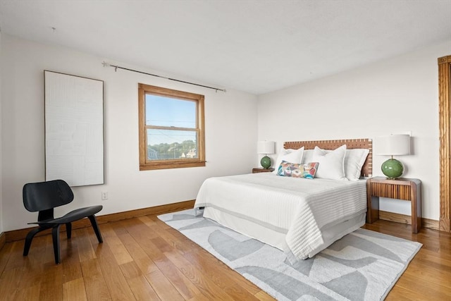 63 Seaside Rd, Scituate, MA 02066 - bedroom featuring baseboards and light wood-style floors