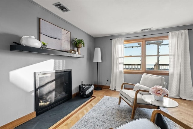 63 Seaside Rd, Scituate, MA 02066 - living area featuring a fireplace with flush hearth and baseboards