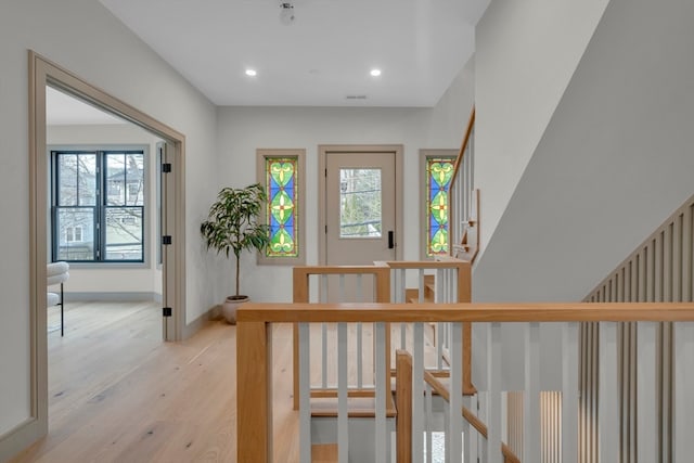 foyer entrance with light hardwood / wood-style flooring