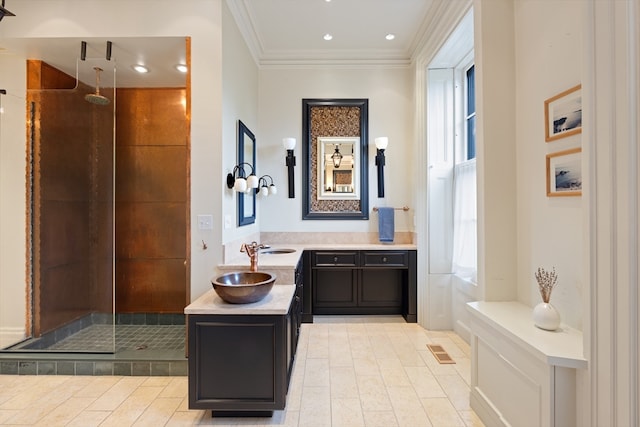 bathroom with a shower with door, vanity, ornamental molding, and tile patterned flooring