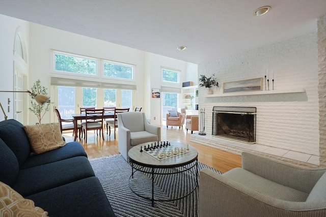 8 Mercer Ln, Franklin, MA 02038 - living room with a fireplace with raised hearth, wood finished floors, and recessed lighting