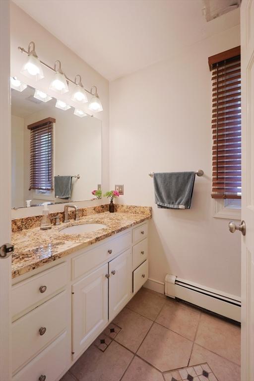 8 Mercer Ln, Franklin, MA 02038 - bathroom featuring a baseboard radiator, vanity, tile patterned flooring, and baseboards