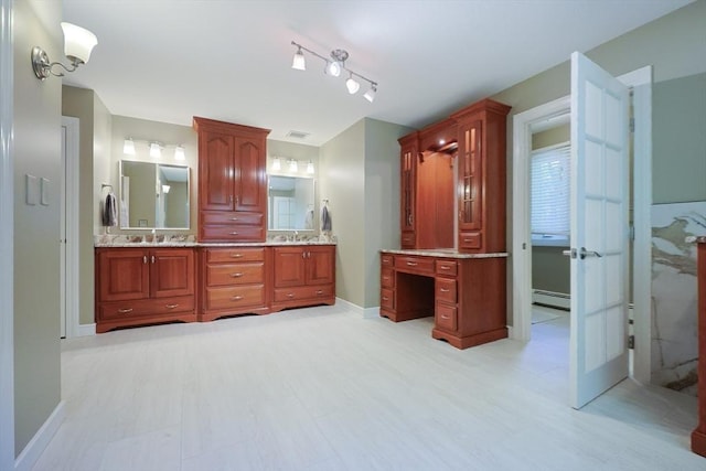 8 Mercer Ln, Franklin, MA 02038 - full bath featuring a baseboard heating unit, double vanity, rail lighting, and baseboards