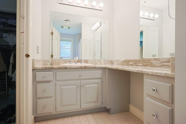 8 Mercer Ln, Franklin, MA 02038 - full bath featuring vanity, a walk in closet, and tile patterned floors