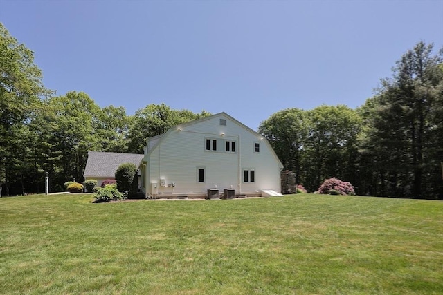 8 Mercer Ln, Franklin, MA 02038 - view of property exterior featuring a yard, cooling unit, and a gambrel roof