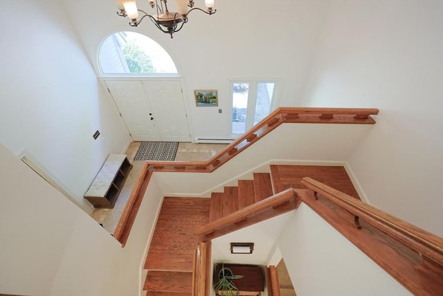 8 Mercer Ln, Franklin, MA 02038 - entryway with a chandelier, baseboard heating, a towering ceiling, and stairway