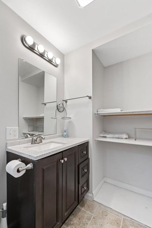 bathroom with vanity and baseboards