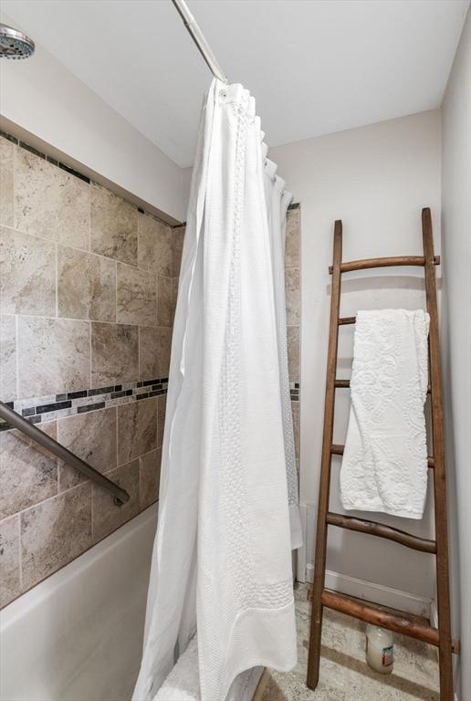 bathroom featuring curtained shower