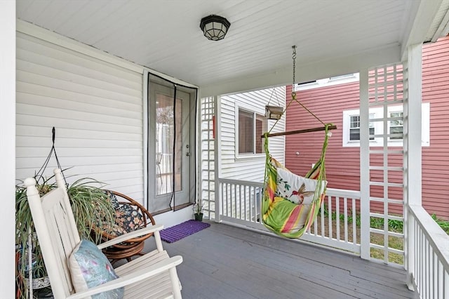 wooden deck featuring covered porch