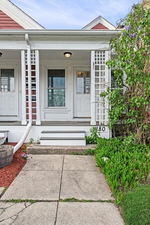 property entrance featuring covered porch