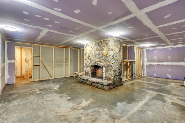 basement featuring a stone fireplace