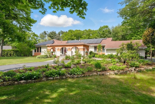 18 Karen Ln, Dartmouth, MA 02747 - ranch-style home with solar panels and a front yard
