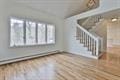 unfurnished living room with wood finished floors