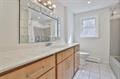 bathroom with vanity and an inviting chandelier