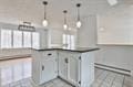 kitchen featuring dark countertops and pendant lighting