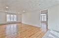 unfurnished room with wood finished floors