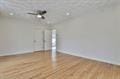 empty room featuring baseboards and wood finished floors