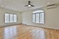 interior space with a ceiling fan and wood finished floors