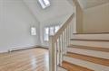 stairway featuring wood finished floors