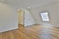 additional living space featuring wood finished floors