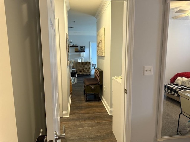 corridor with dark wood-style floors and baseboards