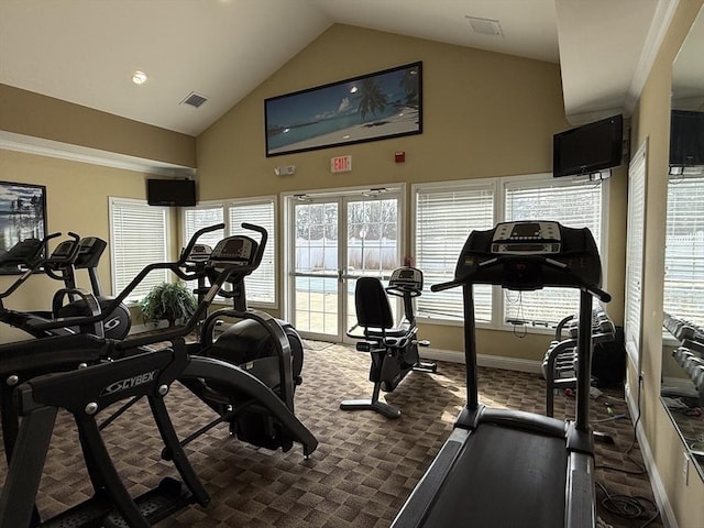 workout area featuring dark colored carpet, high vaulted ceiling, visible vents, and baseboards