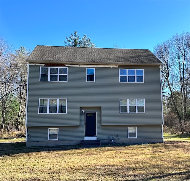 bi-level home featuring a front yard