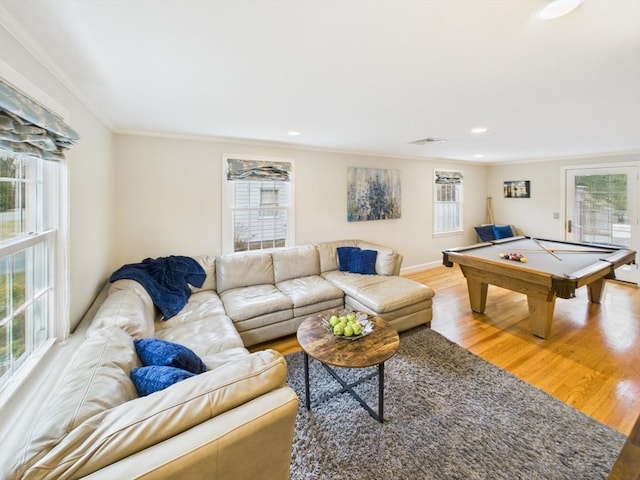 game room with crown molding, a wealth of natural light, visible vents, and light wood finished floors