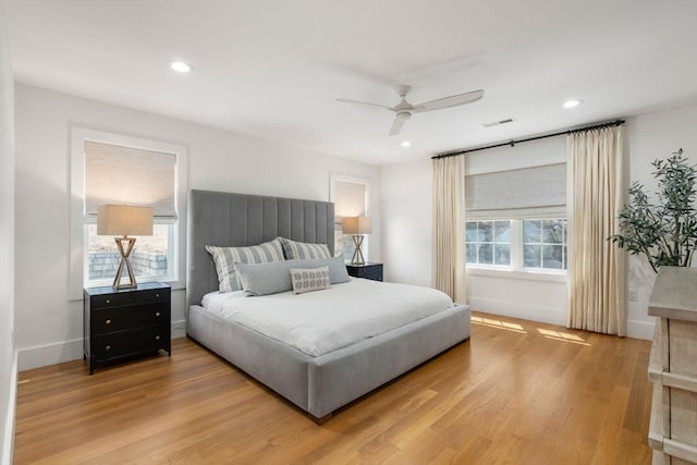 bedroom with recessed lighting, baseboards, and wood finished floors