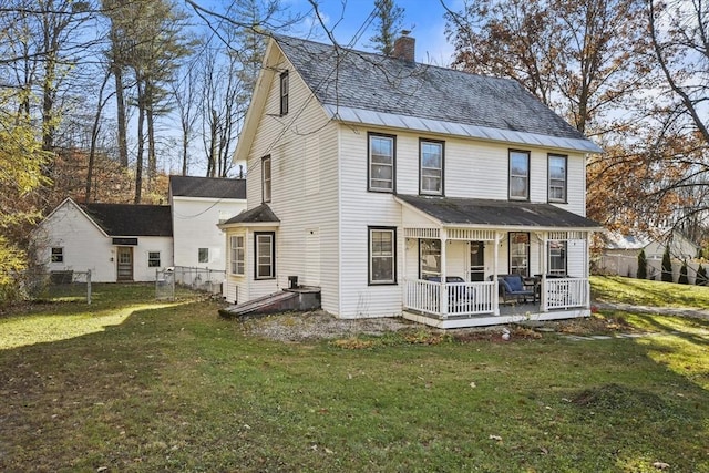 view of front of house featuring a front lawn and a porch