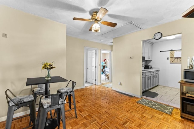 interior space featuring light parquet flooring and ceiling fan