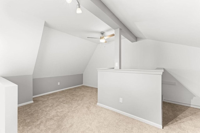 bonus room with ceiling fan, light colored carpet, and lofted ceiling