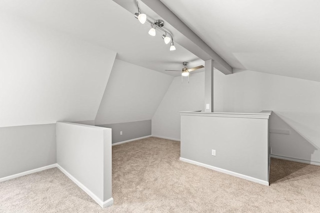 additional living space with light carpet, lofted ceiling, and ceiling fan