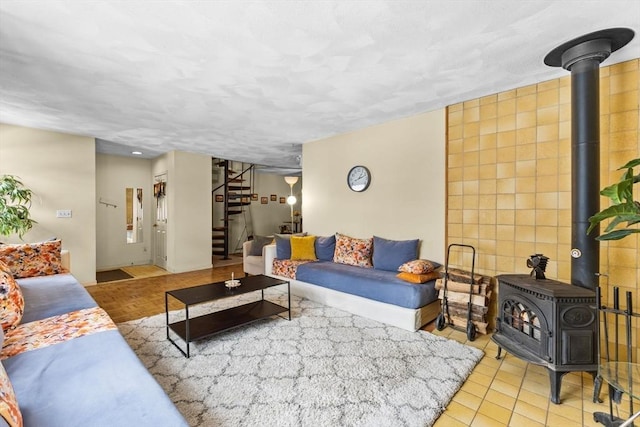 tiled living room with a wood stove