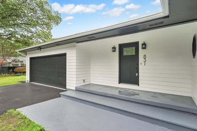 831 Morgan Rd, West Springfield, MA 01089 - property entrance with an attached garage and driveway