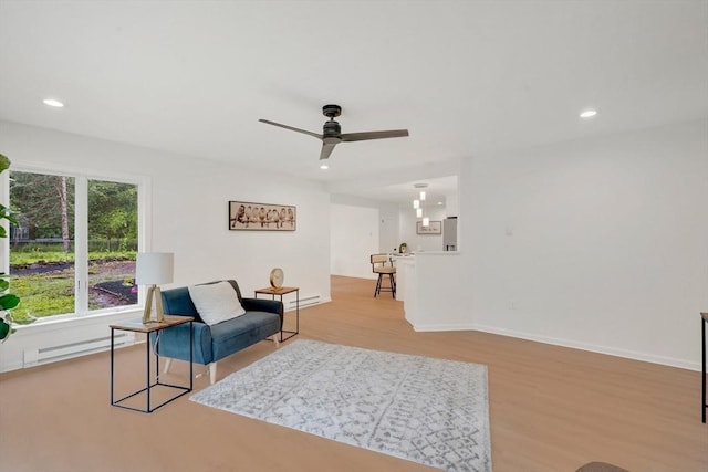 831 Morgan Rd, West Springfield, MA 01089 - sitting room featuring wood finished floors, a ceiling fan, recessed lighting, and a baseboard radiator