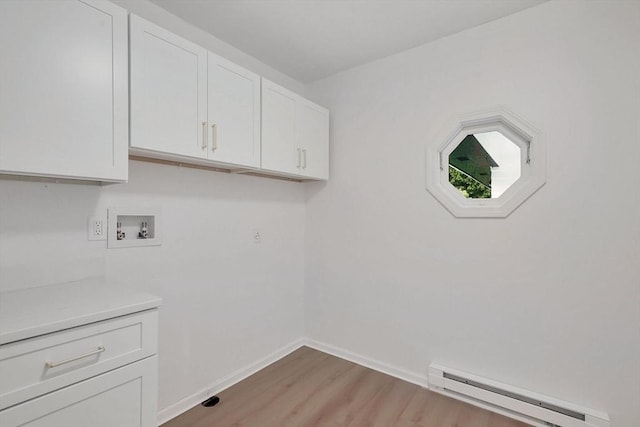 831 Morgan Rd, West Springfield, MA 01089 - laundry area featuring a baseboard heating unit, cabinet space, light wood finished floors, and hookup for a washing machine