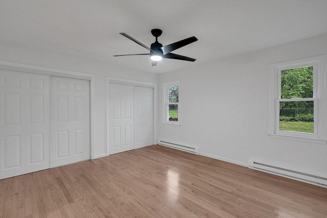 831 Morgan Rd, West Springfield, MA 01089 - unfurnished bedroom featuring a baseboard radiator, multiple closets, light wood-style flooring, and ceiling fan