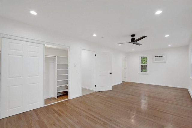 831 Morgan Rd, West Springfield, MA 01089 - unfurnished bedroom with a wall mounted AC, light wood-style flooring, recessed lighting, and a ceiling fan
