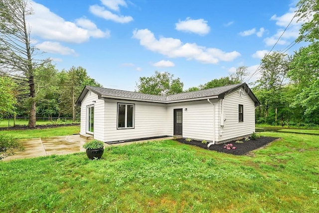 831 Morgan Rd, West Springfield, MA 01089 - back of property with a lawn and a patio
