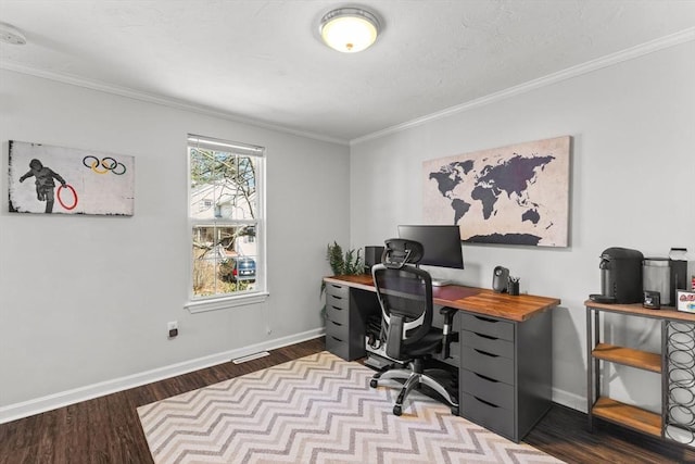 office area featuring visible vents, crown molding, baseboards, and wood finished floors