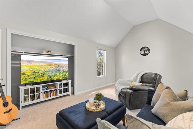 carpeted living area featuring baseboards and vaulted ceiling