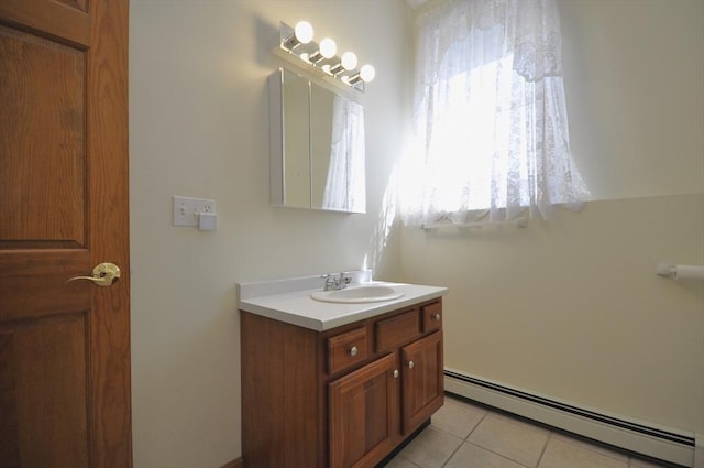 bathroom featuring vanity, tile patterned floors, and a baseboard heating unit