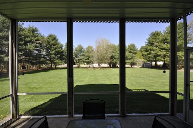 sunroom / solarium featuring a healthy amount of sunlight